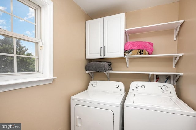 7504 Heathrow Dr, Fredericksburg, VA 22407 - laundry area with cabinet space and washer and dryer