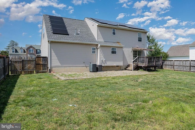 7504 Heathrow Dr, Fredericksburg, VA 22407 - rear view of property featuring roof mounted solar panels, a gate, a wooden deck, a patio, and central air condition unit