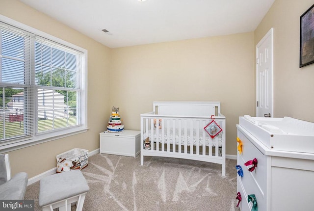 7504 Heathrow Dr, Fredericksburg, VA 22407 - bedroom featuring carpet floors, baseboards, and a nursery area