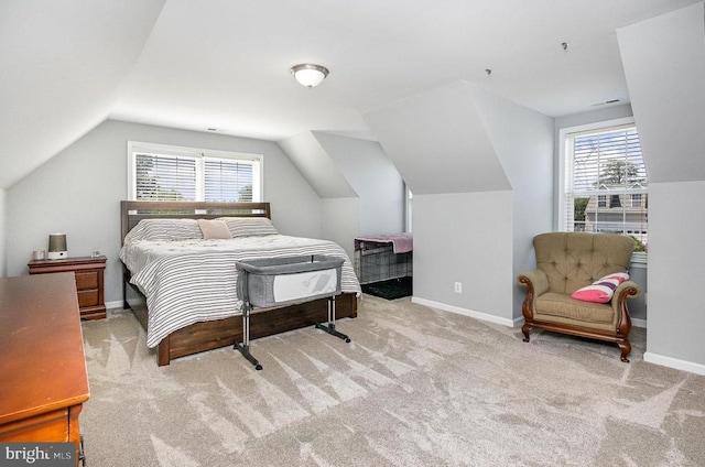 7504 Heathrow Dr, Fredericksburg, VA 22407 - carpeted bedroom featuring lofted ceiling, multiple windows, and baseboards