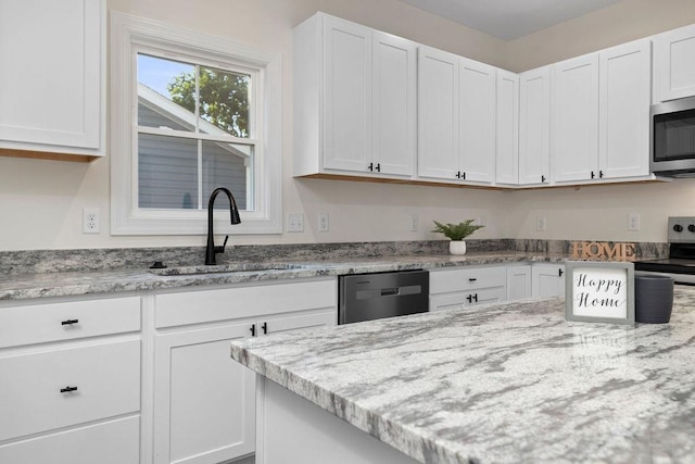 1019 Frye St, Waynesboro, VA 22980 - kitchen with stainless steel appliances, white cabinets, and light stone counters
