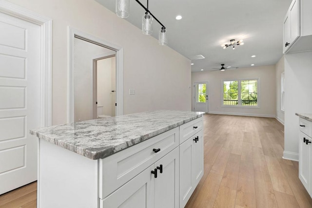 1019 Frye St, Waynesboro, VA 22980 - kitchen featuring a ceiling fan, light stone counters, light wood-style floors, white cabinets, and recessed lighting