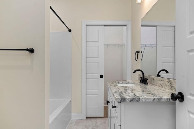 1019 Frye St, Waynesboro, VA 22980 - bathroom with vanity, marble finish floors, a spacious closet, and shower / bathtub combination