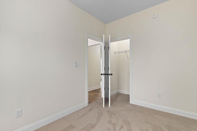 1019 Frye St, Waynesboro, VA 22980 - unfurnished bedroom with carpet flooring, a walk in closet, and a closet