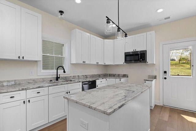 1019 Frye St, Waynesboro, VA 22980 - kitchen featuring stainless steel appliances, light stone counters, white cabinets, wood finished floors, and recessed lighting