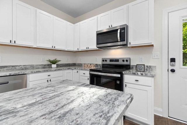 1019 Frye St, Waynesboro, VA 22980 - kitchen with appliances with stainless steel finishes, white cabinets, and light stone counters