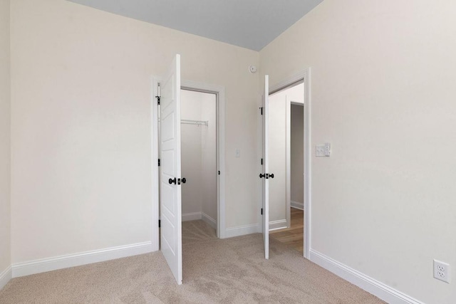 1019 Frye St, Waynesboro, VA 22980 - unfurnished bedroom featuring light colored carpet, a walk in closet, and a closet