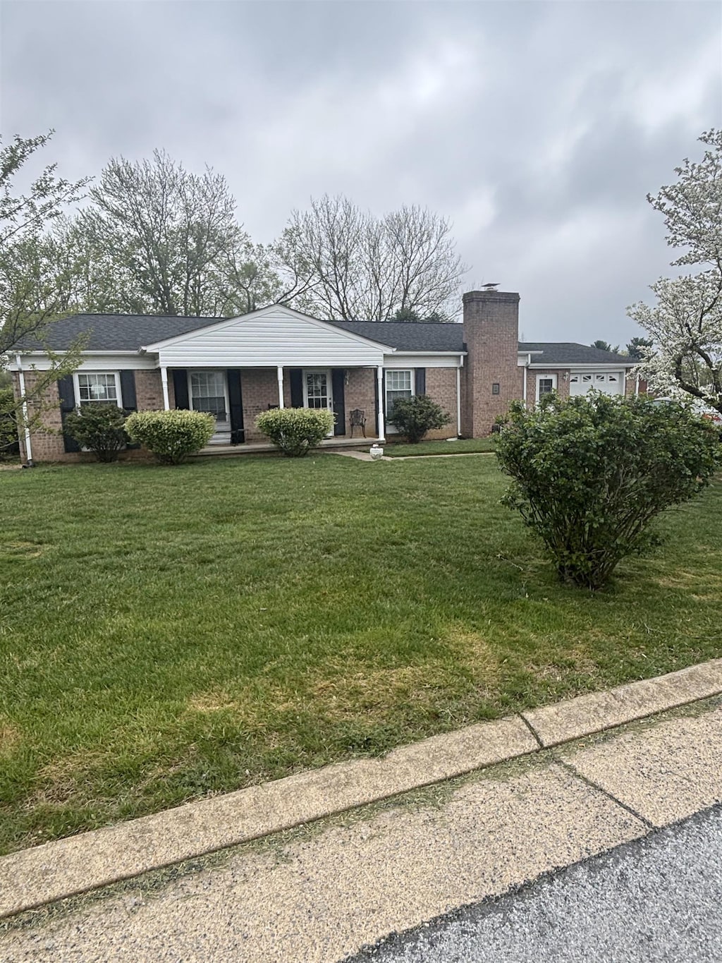 14 Stuart Ave, Stuarts Draft, VA 24477 - single story home featuring brick siding, a chimney, and a front yard