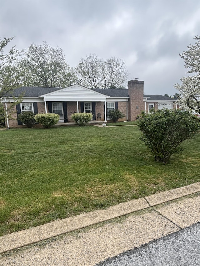 14 Stuart Ave, Stuarts Draft, VA 24477 - single story home featuring brick siding, a chimney, and a front yard