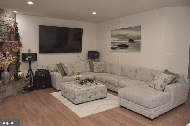 living area featuring wood finished floors and recessed lighting