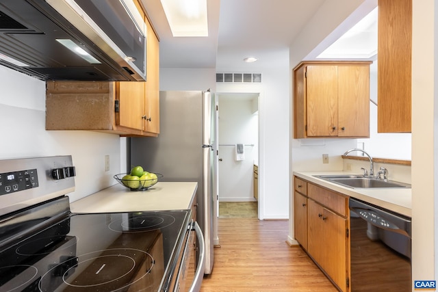 kitchen featuring a sink, exhaust hood, dishwasher, light countertops, and electric range