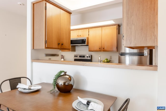 kitchen with light countertops and stainless steel appliances