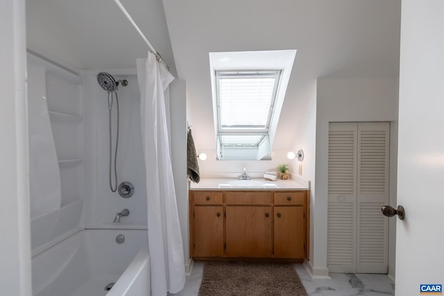 full bathroom with a closet, shower / tub combo with curtain, marble finish floor, and vanity