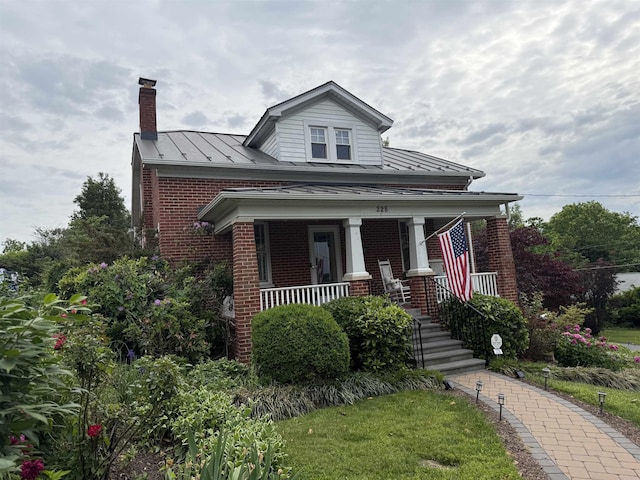 228 Hendren Ave, Staunton, VA 24401 - view of front of home featuring brick siding, a standing seam roof, covered porch, and a chimney