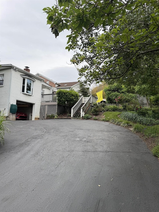 228 Hendren Ave, Staunton, VA 24401 - view of front of home with stairs, asphalt driveway, an attached garage, and a deck