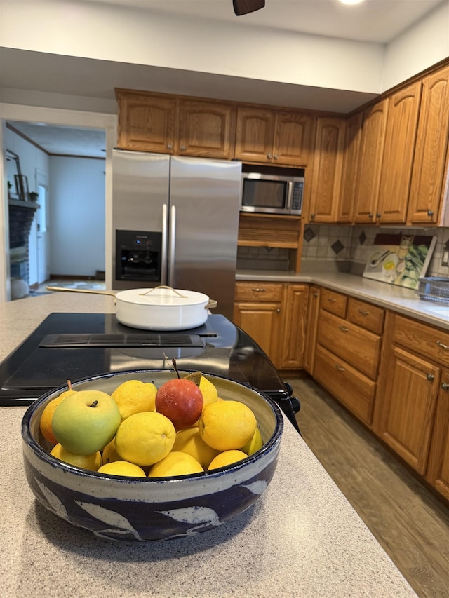 228 Hendren Ave, Staunton, VA 24401 - kitchen with stainless steel appliances, light countertops, and brown cabinetry