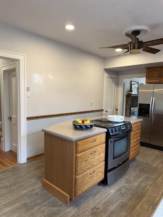 228 Hendren Ave, Staunton, VA 24401 - kitchen featuring stainless steel appliances, a ceiling fan, dark wood-style flooring, brown cabinetry, and baseboards