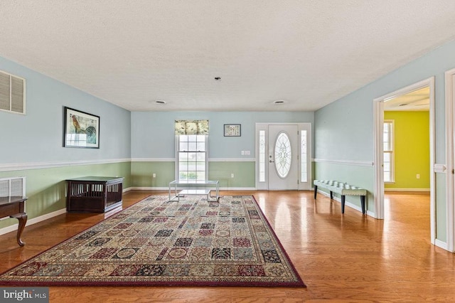 1066 Honeyville Rd, Stanley, VA 22851 - entrance foyer with wood finished floors, a textured ceiling, and baseboards