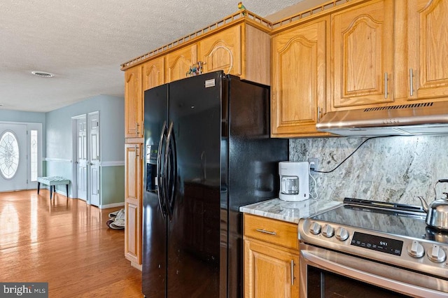 1066 Honeyville Rd, Stanley, VA 22851 - kitchen featuring stainless steel electric range oven, under cabinet range hood, black fridge with ice dispenser, backsplash, and a textured ceiling