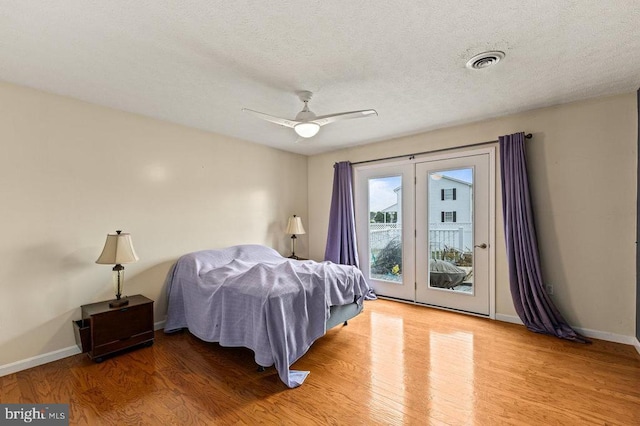 1066 Honeyville Rd, Stanley, VA 22851 - bedroom featuring access to outside, wood finished floors, a textured ceiling, baseboards, and ceiling fan