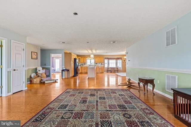 1066 Honeyville Rd, Stanley, VA 22851 - interior space featuring light wood-style floors, baseboards, and a textured ceiling
