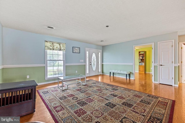 1066 Honeyville Rd, Stanley, VA 22851 - entrance foyer featuring wood finished floors, baseboards, and a textured ceiling