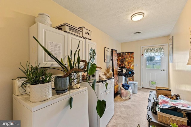 1066 Honeyville Rd, Stanley, VA 22851 - washroom featuring washing machine and clothes dryer and a textured ceiling