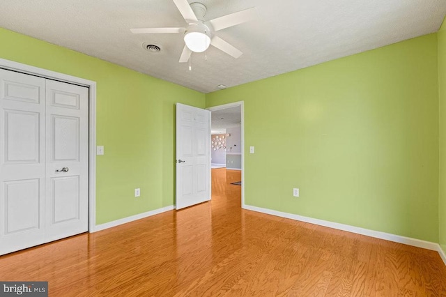 1066 Honeyville Rd, Stanley, VA 22851 - unfurnished bedroom with wood finished floors, baseboards, ceiling fan, and a closet