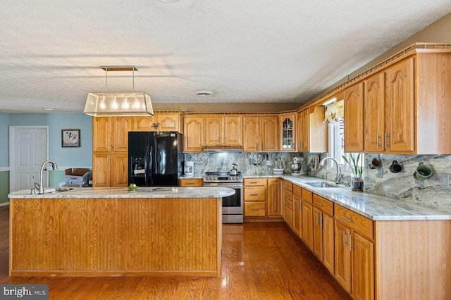 1066 Honeyville Rd, Stanley, VA 22851 - kitchen featuring electric range, black fridge with ice dispenser, a sink, under cabinet range hood, and wood finished floors