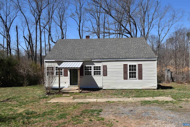 4490 James Madison Hwy, Gordonsville, VA 22942 - view of front of home with a shingled roof, a chimney, and a front lawn