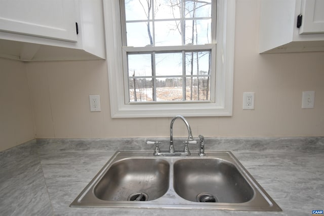 4490 James Madison Hwy, Gordonsville, VA 22942 - details with white cabinets, light countertops, and a sink
