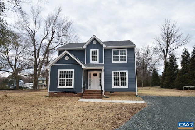 traditional home with crawl space and roof with shingles