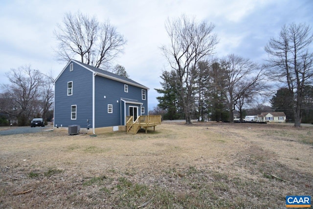 view of side of home with a wooden deck and central air condition unit