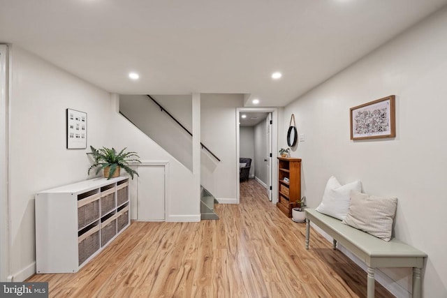  - living area with stairway, light wood-type flooring, recessed lighting, and baseboards