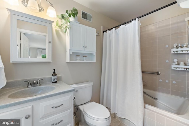  - bathroom featuring vanity, toilet, and shower / bath combo