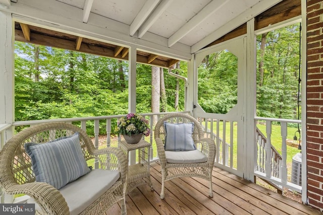  - wooden deck with view of scattered trees