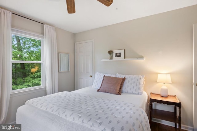  - bedroom with multiple windows and a ceiling fan