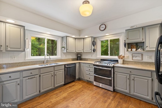  - kitchen featuring gray cabinets, stainless steel appliances, a sink, healthy amount of natural light, and recessed lighting
