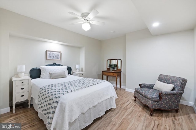  - bedroom featuring light wood-type flooring and baseboards
