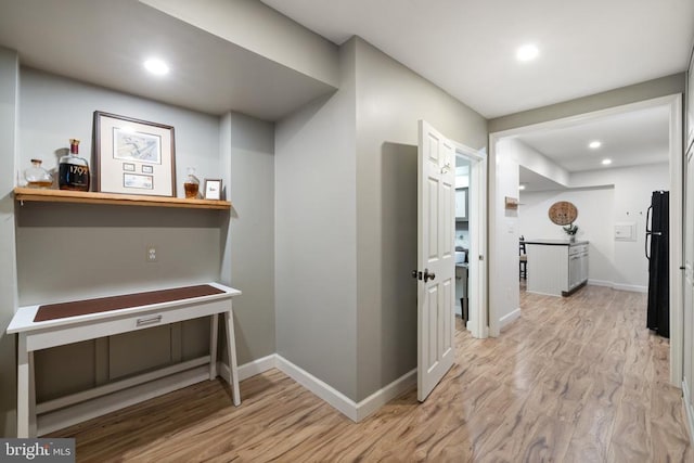  - hallway with light wood-type flooring, baseboards, and recessed lighting