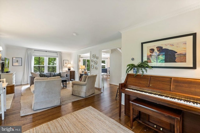  - living room featuring dark wood-style flooring, crown molding, and baseboards