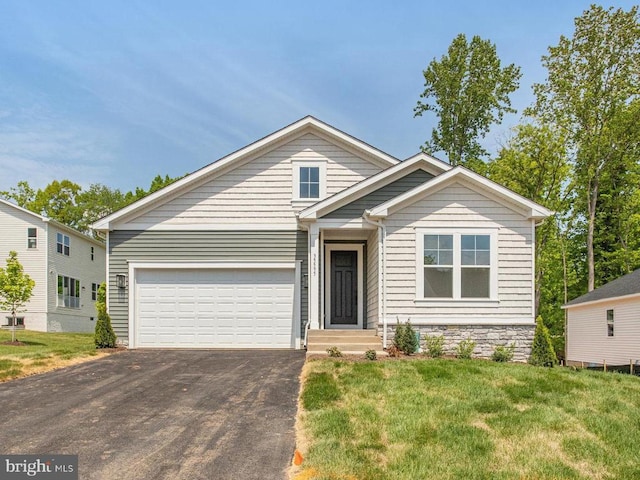 35595 Pine Needle Ln, Locust Grove, VA 22508 - view of front of house featuring driveway, an attached garage, and a front lawn