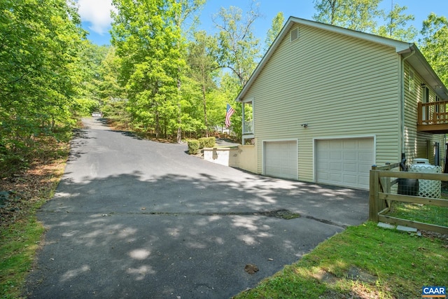 25 Bearwood Dr S, Palmyra, VA 22963 - view of property exterior with a garage and driveway