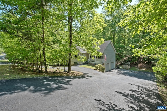 25 Bearwood Dr S, Palmyra, VA 22963 - view of side of property featuring asphalt driveway and a garage