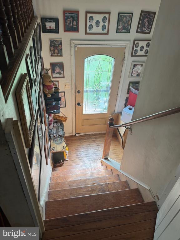 foyer featuring stairway and hardwood / wood-style flooring