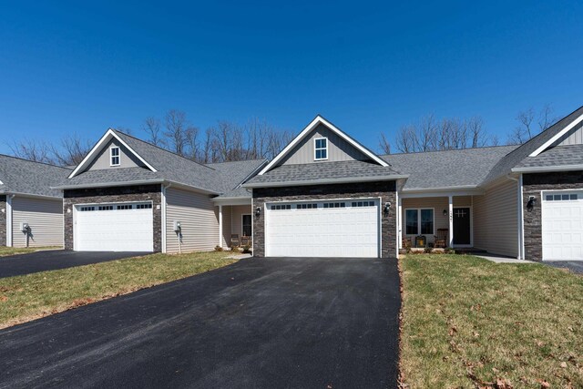 view of front facade with a garage and a front yard