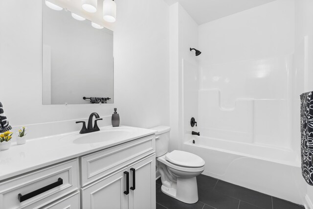 full bathroom featuring vanity, tub / shower combination, tile patterned floors, and toilet