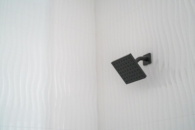 interior details featuring a shower