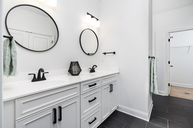 bathroom featuring tile patterned floors and vanity