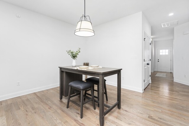 dining space featuring light hardwood / wood-style flooring